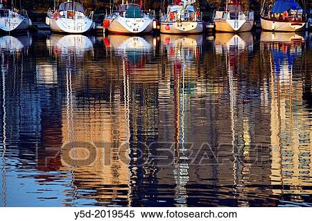 Picturesque reflections of sail boats, Vieux Bassin, Honfleur, Calvados, Normandy, France View Large Photo Image Stock Photography - Picturesque reflections of sail boats, Vieux Bassin, Honfleur, Calvados, Normandy, France. Fotosearch
