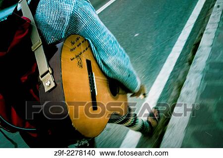 Pilgrim with guitar by the Puente de la Maza bridge, San Vicente de la Barquera, Cantabria, Spain View Large Photo Image Stock Image - Pilgrim with guitar by the Puente de la Maza bridge, San Vicente de la Barquera, Cantabria, Spain. Fotosearch