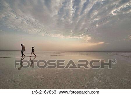 playing in the Lake Assal salt water in the Danakil Depression, Ethiopia. View Large Photo Image Stock Image - playing in the Lake Assal salt water in the Danakil Depression, Ethiopia.. Fotosearch