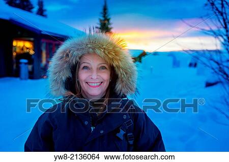 Picture - Portrait of a woman in cold temperatures in Jukkasjarvi, Lapland, Sweden.. Fotosearch