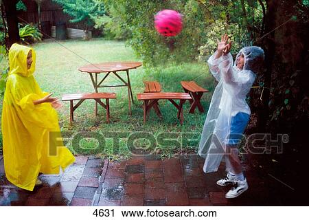 Pre-teen kids playing in the rain View Large Photo Image Stock Image - Pre-teen kids playing in the rain. Fotosearch