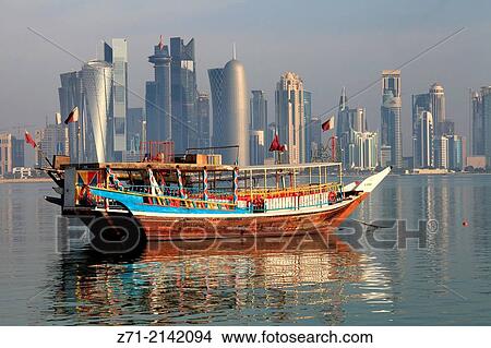 Qatar, Doha, skyline, West Bay, business district, dhow, traditional boat,. View Large Photo Image Picture - Qatar, Doha, skyline, West Bay, business district, dhow, traditional boat,.. Fotosearch