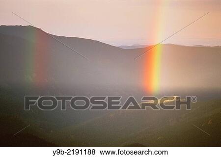 Rainbow over forest and mountains, Mt. Evans Recreation Area, Arapaho National Forest, Colorado, USA. View Large Photo Image Stock Photo - Rainbow over forest and mountains, Mt. Evans Recreation Area, Arapaho National Forest, Colorado, USA.. Fotosearch