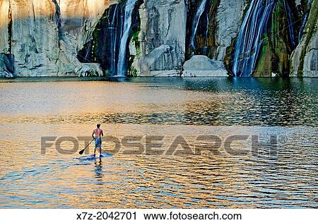 Riding the Stand Up Paddle Board at Shoshone Falls on the Snake River in the Snake River Canyon near the city of Twin Falls in southern Idaho. View Large Photo Image Stock Image - Riding the Stand Up Paddle Board at Shoshone Falls on the Snake River in the Snake River Canyon near the city of Twin Falls in southern Idaho.. Fotosearch