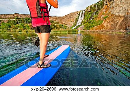 Riding the Standup Paddle Board at Thousand Springs in the Snake River Canyon near the city of Hagerman in southern Idaho. View Large Photo Image Stock Photograph - Riding the Standup Paddle Board at Thousand Springs in the Snake River Canyon near the city of Hagerman in southern Idaho.. Fotosearch