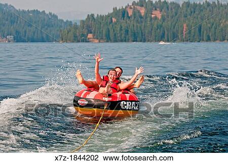 Riding the tube at Payette Lake near the city of McCall in central Idaho View Large Photo Image Stock Image - Riding the tube at Payette Lake near the city of McCall in central Idaho. Fotosearch