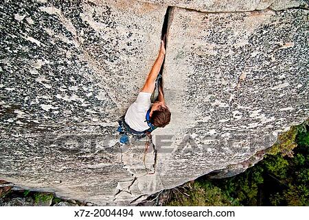 Rock climbing a route called Bishop's Terrace which is rated 5, 8 and located at Church Bowl in Yosemite Valley at Yosemite National Park in California. View Large Photo Image Picture - Rock climbing a route called Bishop's Terrace which is rated 5, 8 and located at Church Bowl in Yosemite Valley at Yosemite National Park in California.. Fotosearch