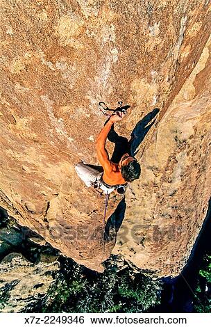 Stock Photograph - Rock climbing a route called Red Rib which is rated 5, 10 and located on Castle Rock at Castle Rocks State Park near the town of Almo in southern Idaho.. Fotosearch