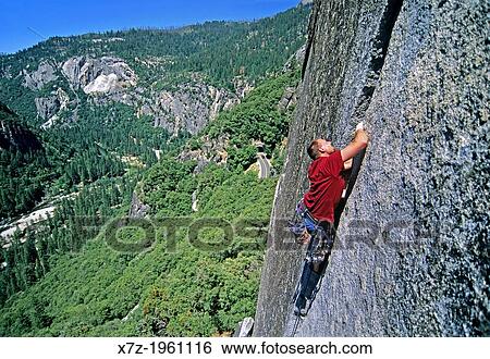 Rock climbing a route called Reeds Pinnacle Direct which is rated 5, 10 and located on Reeds Pinnacle in Yosemite Valley at Yosemite National Park in California. View Large Photo Image Stock Photograph - Rock climbing a route called Reeds Pinnacle Direct which is rated 5, 10 and located on Reeds Pinnacle in Yosemite Valley at Yosemite National Park in California.. Fotosearch