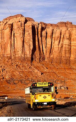 Schoolbus in a Landscape of red mesas. Monument valley, Navajo reservation. Utah. United states (USA). View Large Photo Image Stock Image - Schoolbus in a Landscape of red mesas. Monument valley, Navajo reservation. Utah. United states (USA).. Fotosearch