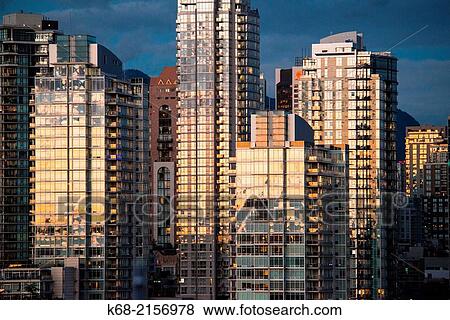 Stock Photo - skyline condo towers at sunset on the north shore of False Creek, Vancouver, BC, Canada.. Fotosearch