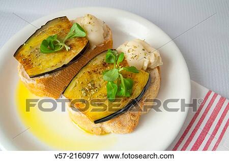 Spanish tapa: grilled aubergine with Torta del Casar cheese. View Large Photo Image Stock Photo - Spanish tapa: grilled aubergine with Torta del Casar cheese.. Fotosearch