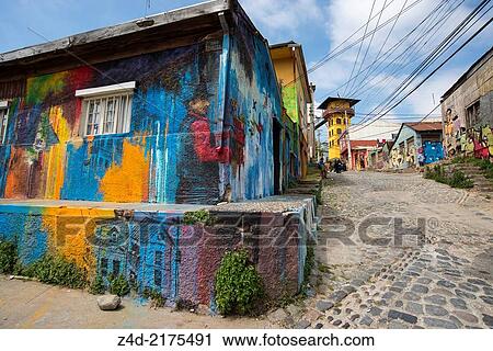 Stock Image - Street art murals and Tower of Ascensor Polanco, opened in 1916. National Monument since 1976. ValparaÃ­so, Chile, South America.. Fotosearch