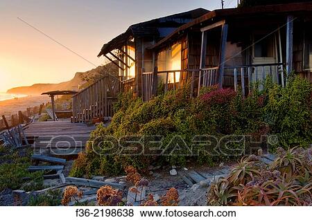 Stock Photo - Sunset and old beach bungalow cabins at Crystal Cove State Park Historic District, Corona del Mar, Newport Beach, California.. Fotosearch