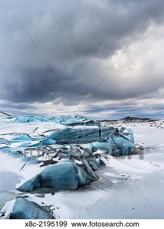 Svinafellsjoekull glacier in Vatnajoekull NP during Winter, view over the frozen glacial lake and the melting glacial front. europe, northern europe, scandinavia, iceland, February. View Large Photo Image Stock Photo - Svinafellsjoekull glacier in Vatnajoekull NP during Winter, view over the frozen glacial lake and the melting glacial front. europe, northern europe, scandinavia, iceland, February.. Fotosearch
