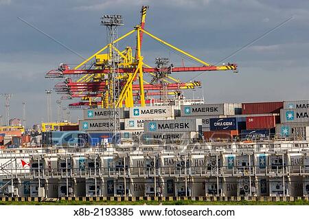 The busy shipyards in the Sea Port of St. Petersburg, on the Neva River, Russia. View Large Photo Image Stock Photography - The busy shipyards in the Sea Port of St. Petersburg, on the Neva River, Russia.. Fotosearch