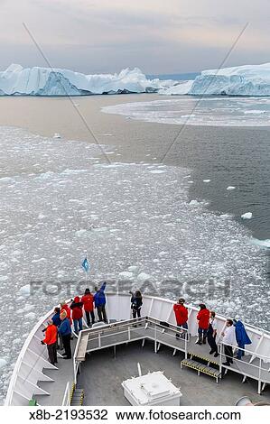The Lindblad Expeditions ship National Geographic Explorer amongst huge icebergs, Ilulissat, Greenland. View Large Photo Image Stock Image - The Lindblad Expeditions ship National Geographic Explorer amongst huge icebergs, Ilulissat, Greenland.. Fotosearch