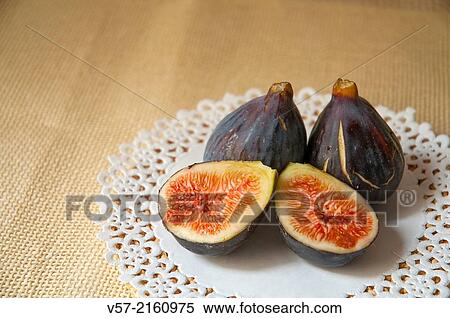 Three black figs, one of them cut in two halves. View Large Photo Image Stock Photography - Three black figs, one of them cut in two halves.. Fotosearch