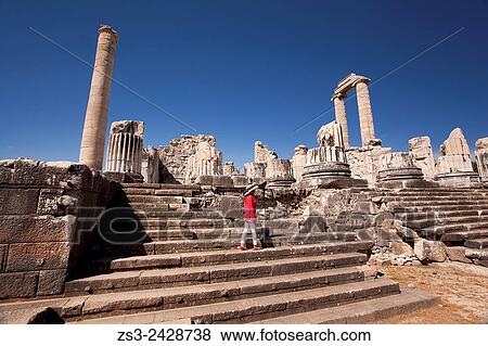 Tourist at the Temple of Apollo at the Archeological area of Didim, Didyma, Aydin Province, Turkey, Europe. View Large Photo Image Stock Photo - Tourist at the Temple of Apollo at the Archeological area of Didim, Didyma, Aydin Province, Turkey, Europe.. Fotosearch