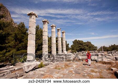 Picture - Tourist at the Temple of Athena at the ancient city of Priene, Soke, Aydin, Turkey, Europe.. Fotosearch