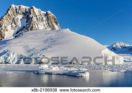 Transiting the Lemaire Channel in heavy first year sea ice, Antarctica. View Large Photo Image Stock Photo - Transiting the Lemaire Channel in heavy first year sea ice, Antarctica.. Fotosearch