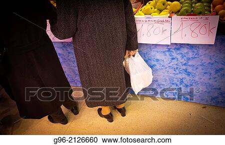 two seniors in front of a stop market at Ruzafa market, Valencia, Spain View Large Photo Image Stock Image - two seniors in front of a stop market at Ruzafa market, Valencia, Spain. Fotosearch