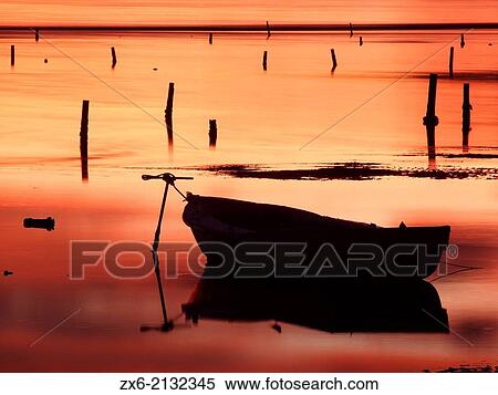 Stock Photography - Two small birds on fishing boat at Alfacs Bay. Ebro River Delta Natural Park, Tarragona province, Catalonia, Spain.. Fotosearch