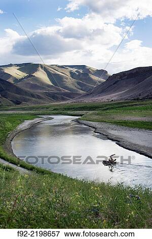 Stock Photo - USA, Oregon, Malheur County, View of Leslie Gulch mountains and Owyhee River. Fotosearch