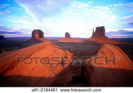 USA. SOUTH WEST. ARIZONA & UTAH. NAVAJO RESERVATION OF MONUMENT VALLEY. RED ROCKS PEAKS (MESAS) AT SUNSET. View Large Photo Image Stock Image - USA. SOUTH WEST. ARIZONA & UTAH. NAVAJO RESERVATION OF MONUMENT VALLEY. RED ROCKS PEAKS (MESAS) AT SUNSET.. Fotosearch