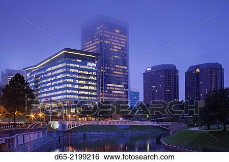 Stock Photograph - USA, Virginia, Richmond, skyline along James River Canal, dawn.. Fotosearch