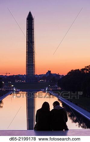 USA, Washington DC, Washington Monument with couple, at dawn. View Large Photo Image Stock Photo - USA, Washington DC, Washington Monument with couple, at dawn.. Fotosearch