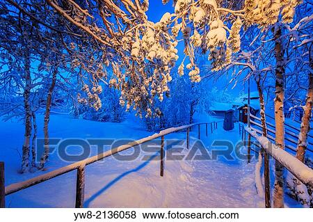 Stock Photo - Walking path close to the Ice Hotel, Jukkasjarvi, Lapland, Sweden. Extreme cold temperatures.. Fotosearch