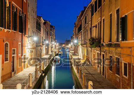 Stock Photograph - Water canal in blue hour in Venice Italy. Fotosearch