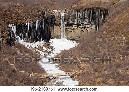 Well-known waterfall in iceland over a basaltic columnar system. View Large Photo Image Stock Image - Well-known waterfall in iceland over a basaltic columnar system.. Fotosearch