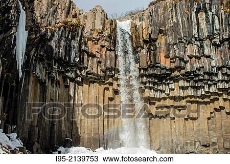 Stock Image - Well-known waterfall in iceland over a basaltic columnar system.. Fotosearch