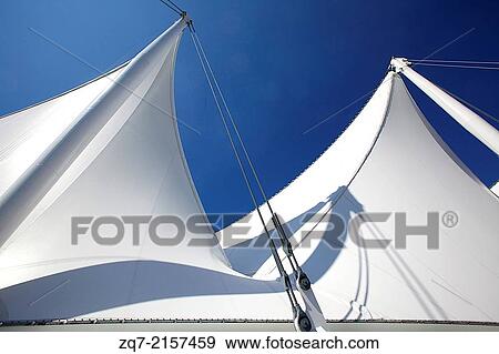 White roof of the building on Balentien Pier, Port of Vancouver, British Columbia, Canada, against the blue sky. View Large Photo Image Stock Photo - White roof of the building on Balentien Pier, Port of Vancouver, British Columbia, Canada, against the blue sky.. Fotosearch