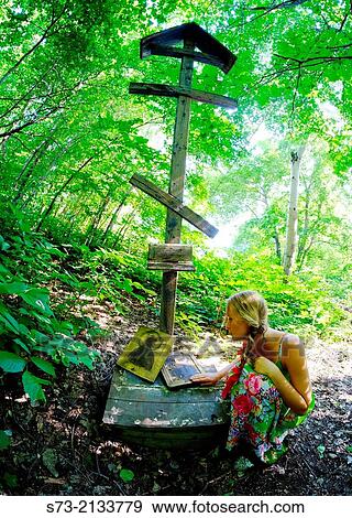 Woman and icons in the forest, Kuz´kino, Russian Federation View Large Photo Image Stock Photo - Woman and icons in the forest, Kuz´kino, Russian Federation. Fotosearch