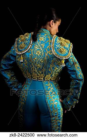 Woman bullfighter suit with blue lights on a black background. View Large Photo Image Stock Image - Woman bullfighter suit with blue lights on a black background.. Fotosearch