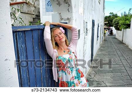Woman in Stromboli street, Sicily, Italy View Large Photo Image Stock Image - Woman in Stromboli street, Sicily, Italy. Fotosearch