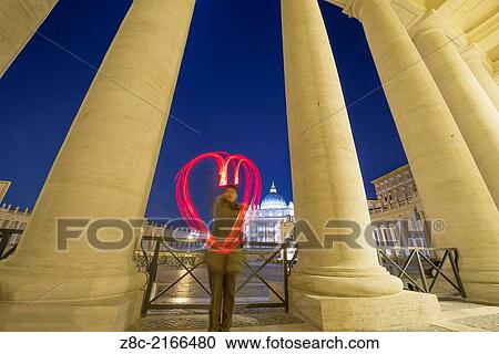 Woman light painting a heart in Vatican City In Rome, Italy View Large Photo Image Stock Image - Woman light painting a heart in Vatican City In Rome, Italy. Fotosearch