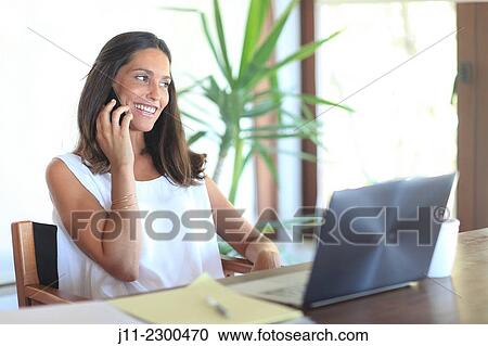Woman on cell phone View Large Photo Image Stock Image - Woman on cell phone. Fotosearch