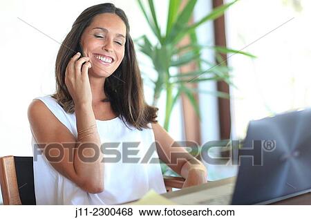 Woman on cell phone View Large Photo Image Stock Photo - Woman on cell phone. Fotosearch