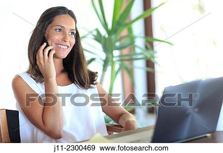 Woman on cell phone View Large Photo Image Stock Photo - Woman on cell phone. Fotosearch