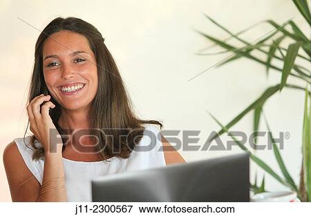 Woman on cell phone View Large Photo Image Stock Photo - Woman on cell phone. Fotosearch