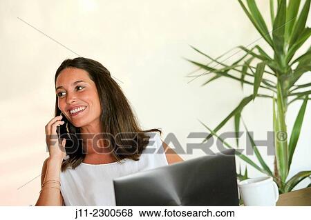 Woman on cell phone View Large Photo Image Stock Photo - Woman on cell phone. Fotosearch