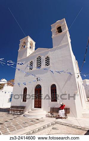 Woman sitting in front of the church of Panagia Korfiatissa in Plaka village, Milos, Cyclades Islands, Greek Islands, Greece, Europe. View Large Photo Image Stock Image - Woman sitting in front of the church of Panagia Korfiatissa in Plaka village, Milos, Cyclades Islands, Greek Islands, Greece, Europe.. Fotosearch
