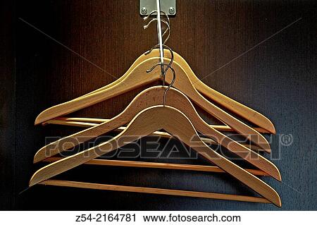 Stock Image - Wooden coat hanger at hotel, Spain.. Fotosearch