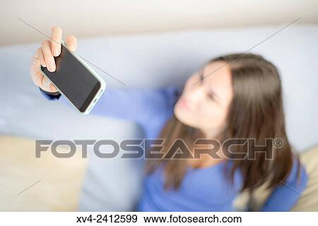 Stock Photo - Young Woman selfie.. Fotosearch