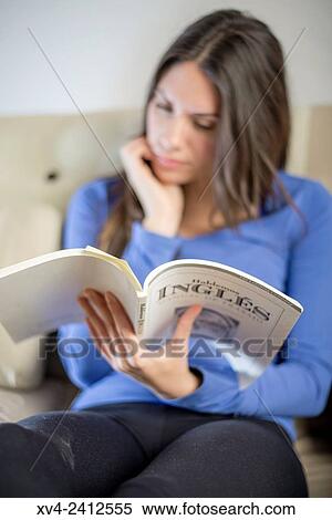 Young Woman studing English on her sofa. View Large Photo Image Stock Photography - Young Woman studing English on her sofa.. Fotosearch