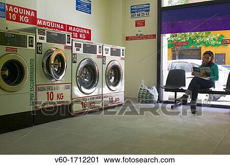 -Woman sitting in Laundry- Cambrils (Spain). View Large Photo Image Stock Image - -Woman sitting in Laundry- Cambrils (Spain).. Fotosearch